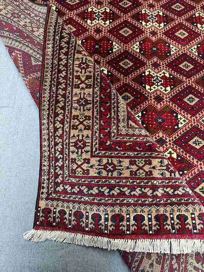 Folded view showing softness and thickness of handmade wool silk rug