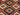 Geometric red, green & black tribal pattern – close-up of 5x6.8 Kilim rug.