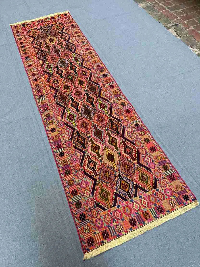 Long hallway decorated with antique Turkish Kilim rug