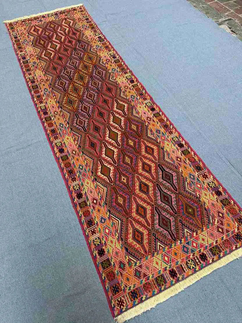 Turkish kilim runner rug placed in a bohemian-style hallway