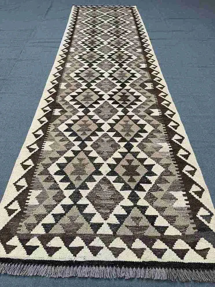 Flatweave Kilim runner on rustic hallway floor – boho décor