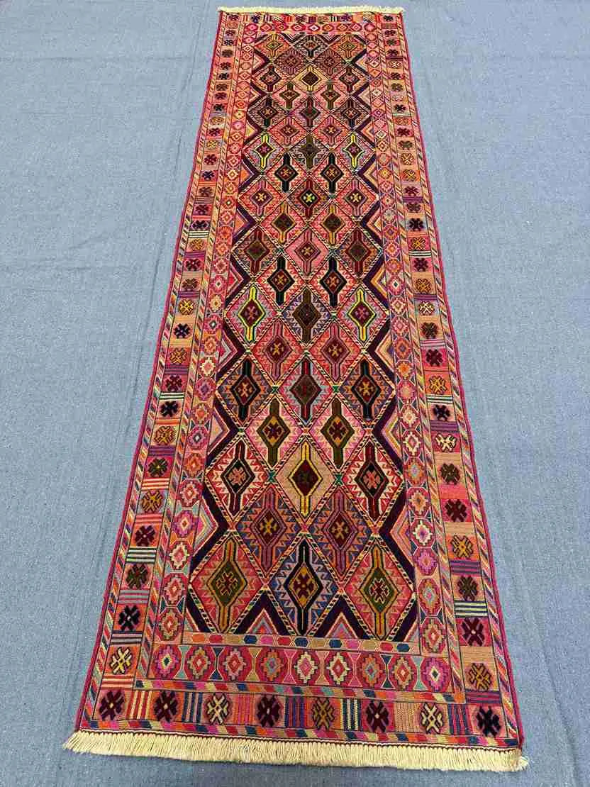 Bohemian Kilim wool runner on beige floor