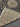 Folded corner of blue Persian Nain rug with hand-knotted finish