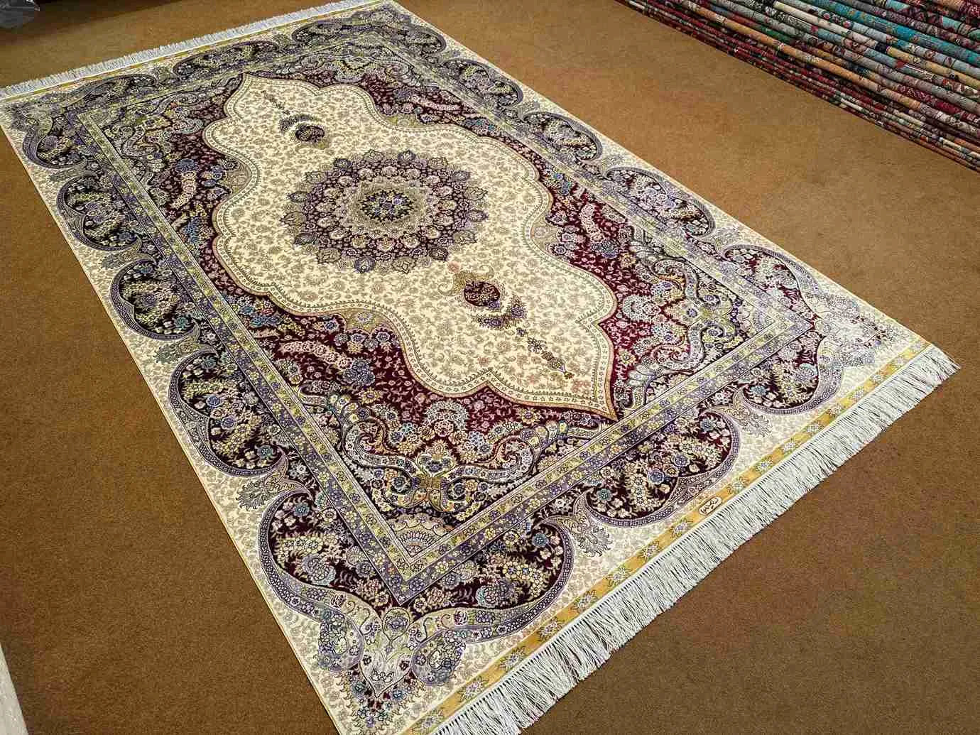 Wide floor view of hand-knotted silk Persian-style carpet