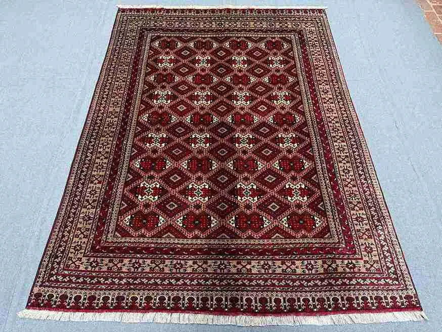 Luxury Persian-style Afghan rug floor placement for home interior