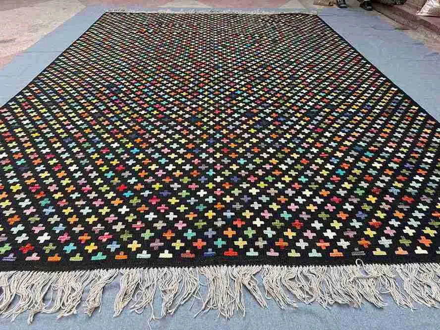 Multicolor flatweave Turkish Kilim rug displayed on floor in modern rustic home.