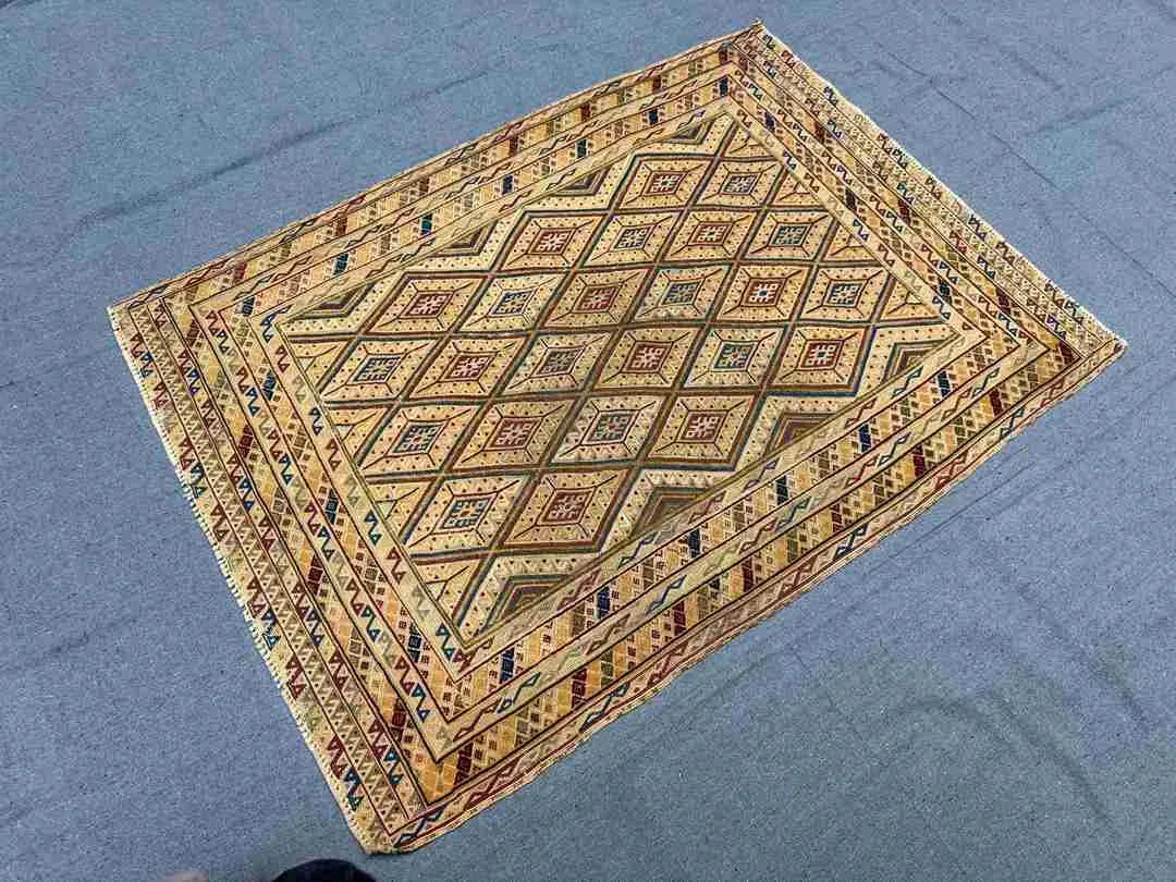 Top floor view of multicolor handmade kilim rug with tribal design
