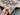Handmade Navy & Beige Ziegler Rug 4.10x6.6 ft shown in hands – Persian floral wool area carpet