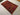 Oriental rug with animal motifs styled on the floor in rustic interior