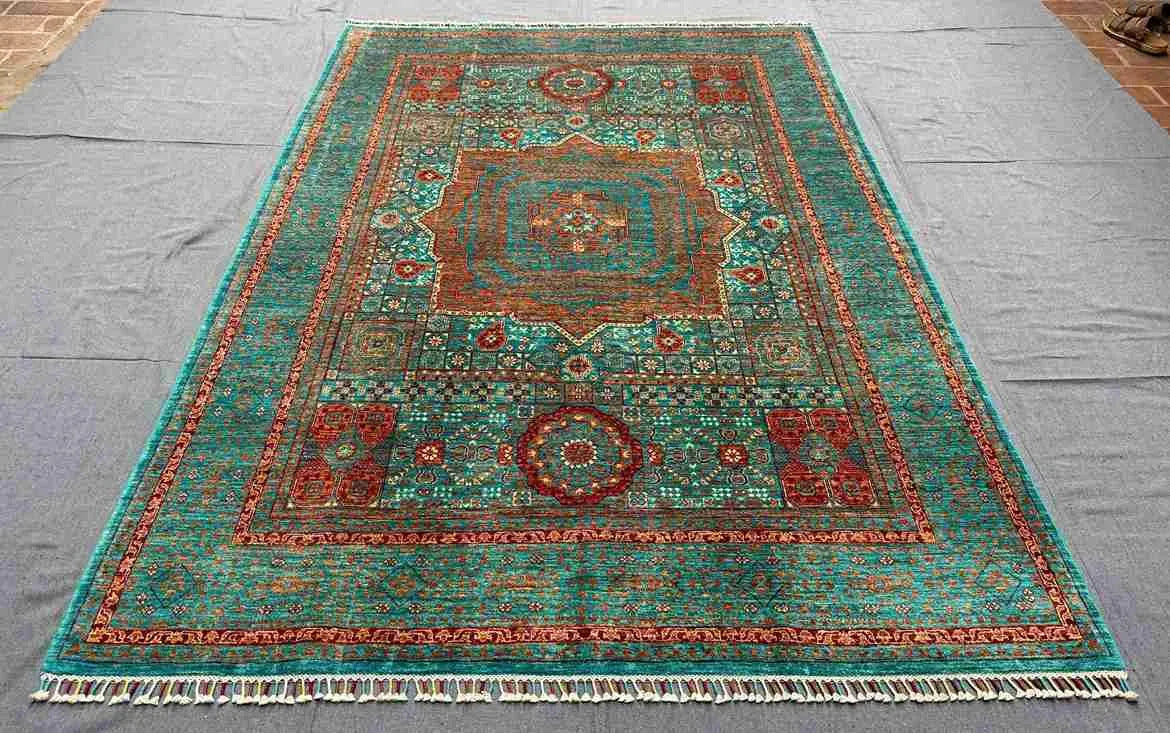 Persian-style Mamluk carpet on living room floor with traditional decor