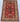 Full view of handmade red Turkish wool rug displayed on modern floor