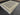 Large Oushak rug in black and beige styled on living room floor