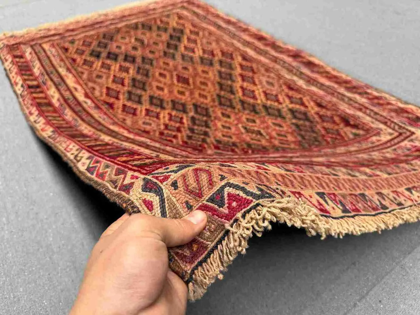 Handmade Persian Afghan rug 2.11x4.6 ft shown in hands – red wool kilim tribal carpet