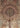 Hand-knotted floral detailing on Persian silk area rug