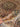 Handmade Persian Silk Rug 5x7 ft held to show fabric quality