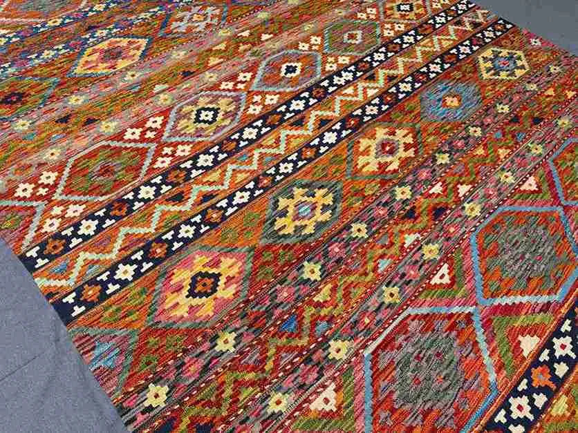 Persian-style Khorjin rug in modern room setting – colorful 8x11 handmade flatweave.