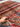 5x8 Red Khorjin Rug held in hands – Handmade Persian wool carpet
