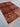 Red handmade Khorjin rug in a modern room setting – wool tribal area rug
