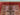 Close-up of red Mamluk rug medallion pattern – Persian style