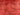 Close-up of distressed pattern on red overdyed wool rug