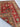 Folded view of red wool Turkish rug – handmade flatweave texture