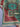 Folded angle view of 6x8 red and teal wool Mamluk rug