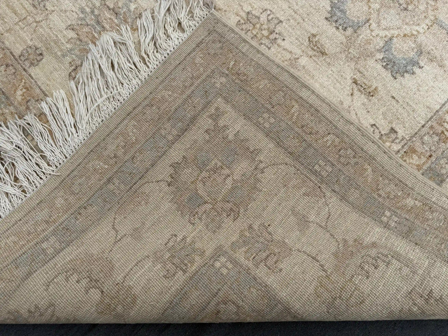 Back view of folded Ziegler rug showing fine knotted craftsmanship