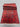 Folded view of 3x10 Oriental red rug highlighting wool silk knotting and quality