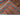 Folded view of authentic Afghan shawl rug – multicolor tribal pattern.