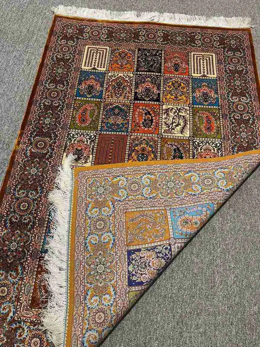 Handmade silk Persian-style rug neatly folded