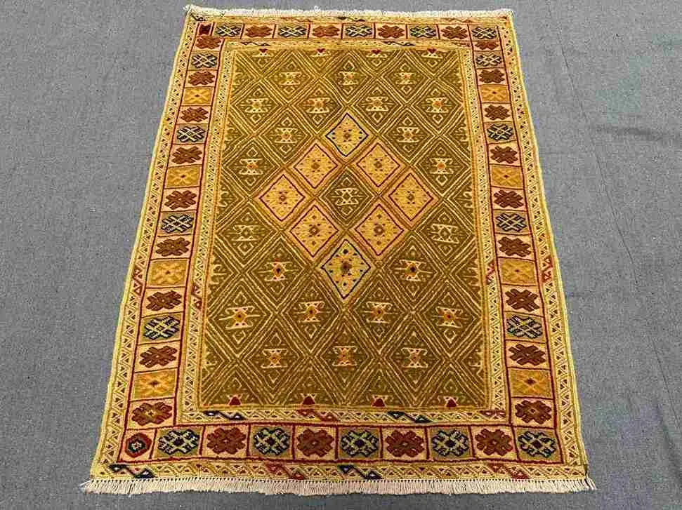 2.10x3.8 Persian Afghan kilim on living room floor with geometric design