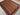 Colorful handmade shawl rug on wood flooring – Afghan decor carpet.