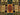 Close-up of wool texture and vibrant color patches on Afghan patchwork rug