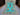 Full view of Tree of Life wool carpet in turquoise blue on floor