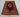 Handmade tribal wool rug placed on wooden floor in living room