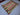 Diagonal top view of wool Turkish Kilim rug on hardwood floor – ethnic decor