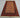 Handmade beige and red Turkish rug styled on wooden floor