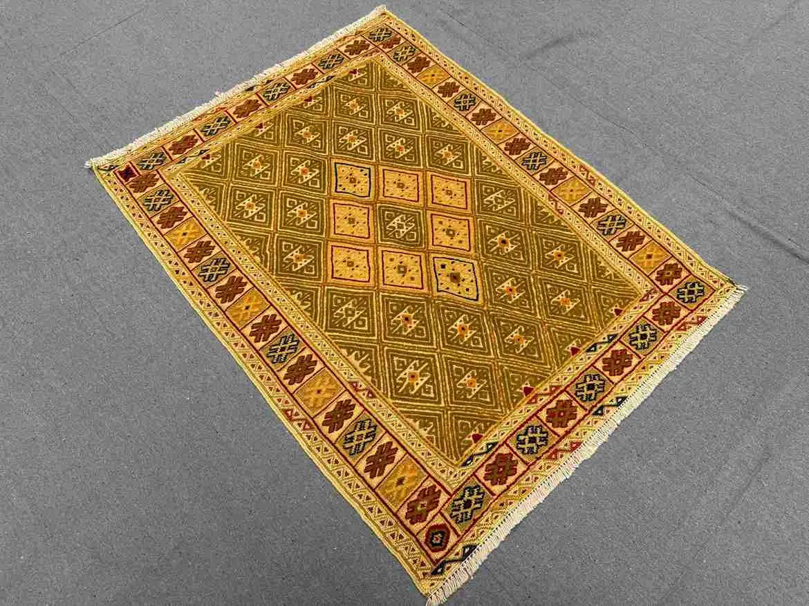 Vintage flatweave wool kilim rug styled on modern home floor