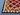 Corner detail of 5x7 handmade red kilim rug – vintage geometric design