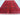 Handmade red wool tribal rug styled in a bedroom