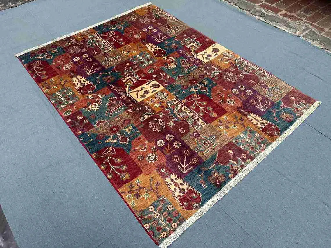 Room view of vintage wool patchwork rug with colorful Persian elements