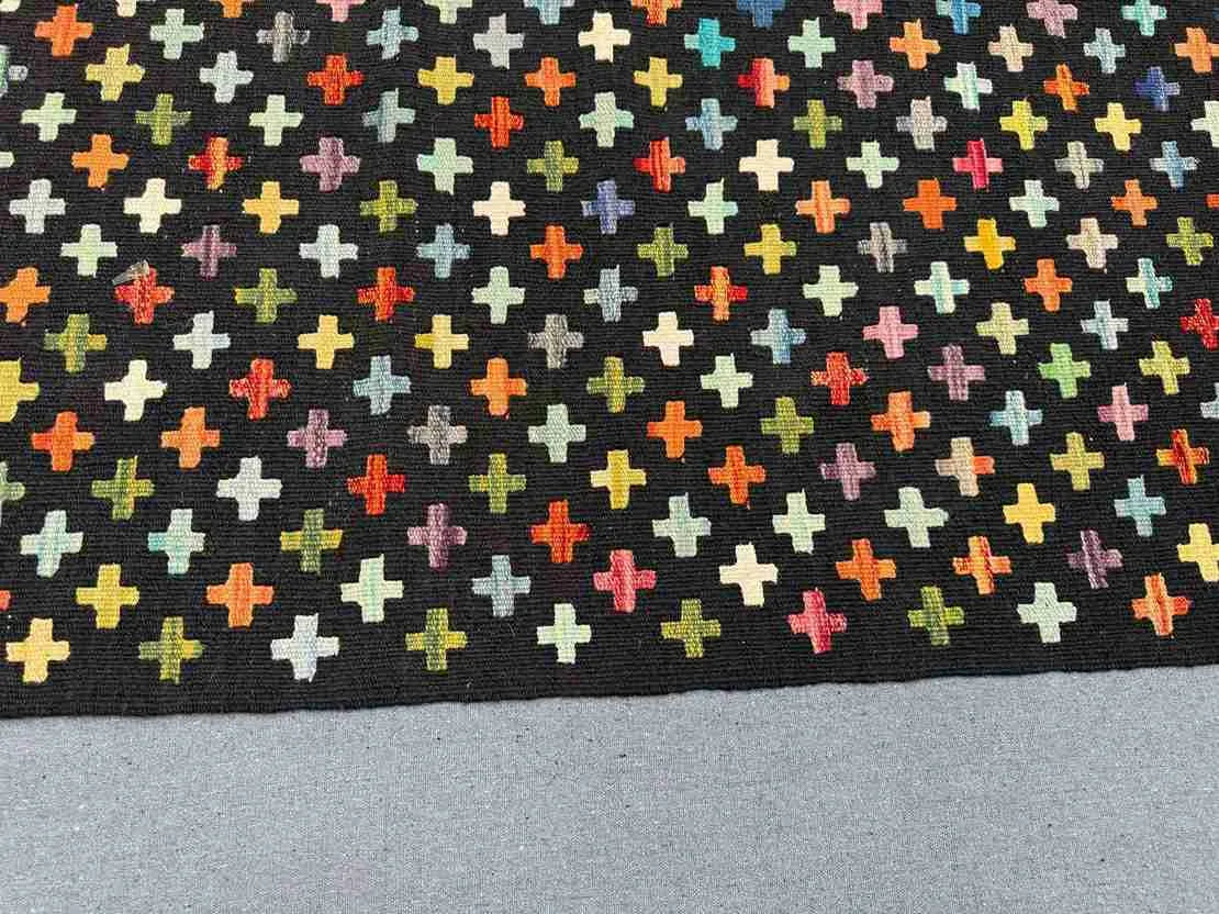 Close-up of wool flatweave texture – handmade Turkish Kilim rug with modern colorful design