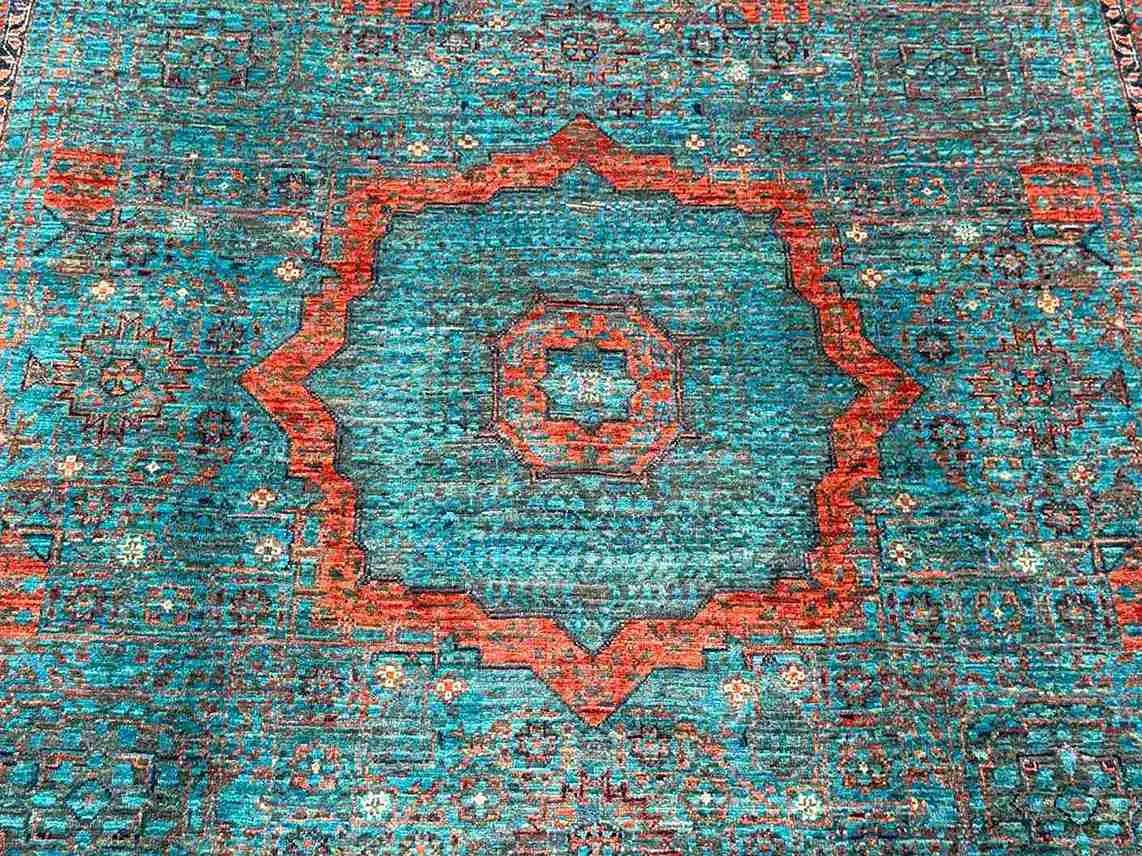 Close-up of handwoven wool texture on Turkish 6x8 Mamluk rug