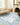 Handmade Turkish Oushak rug with soft wool, beige and blue floral design, traditional Oriental carpet on hardwood floor