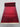 Folded view of red handmade hallway rug – showing rug thickness and texture