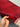 Handmade red 3x12 runner rug held in hand – front texture and weave detail