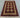 Red and cream Afghan tribal rug in 3x4 size laid flat on wooden floor