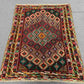 3.2x4 ft tribal kilim rug placed in a cozy living room setting