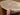 Handmade 4x6 silk rug displayed in hands – Persian-style knotted carpet