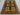 4x7 handmade patchwork rug laid on living room floor with colorful sections